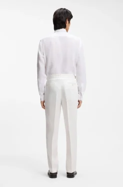 Relaxed-fit trousers in linen with front pleats