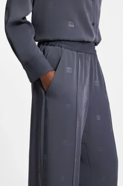 Relaxed-fit trousers with stacked logos