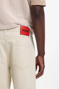 Relaxed-tapered-fit jeans in ecru denim