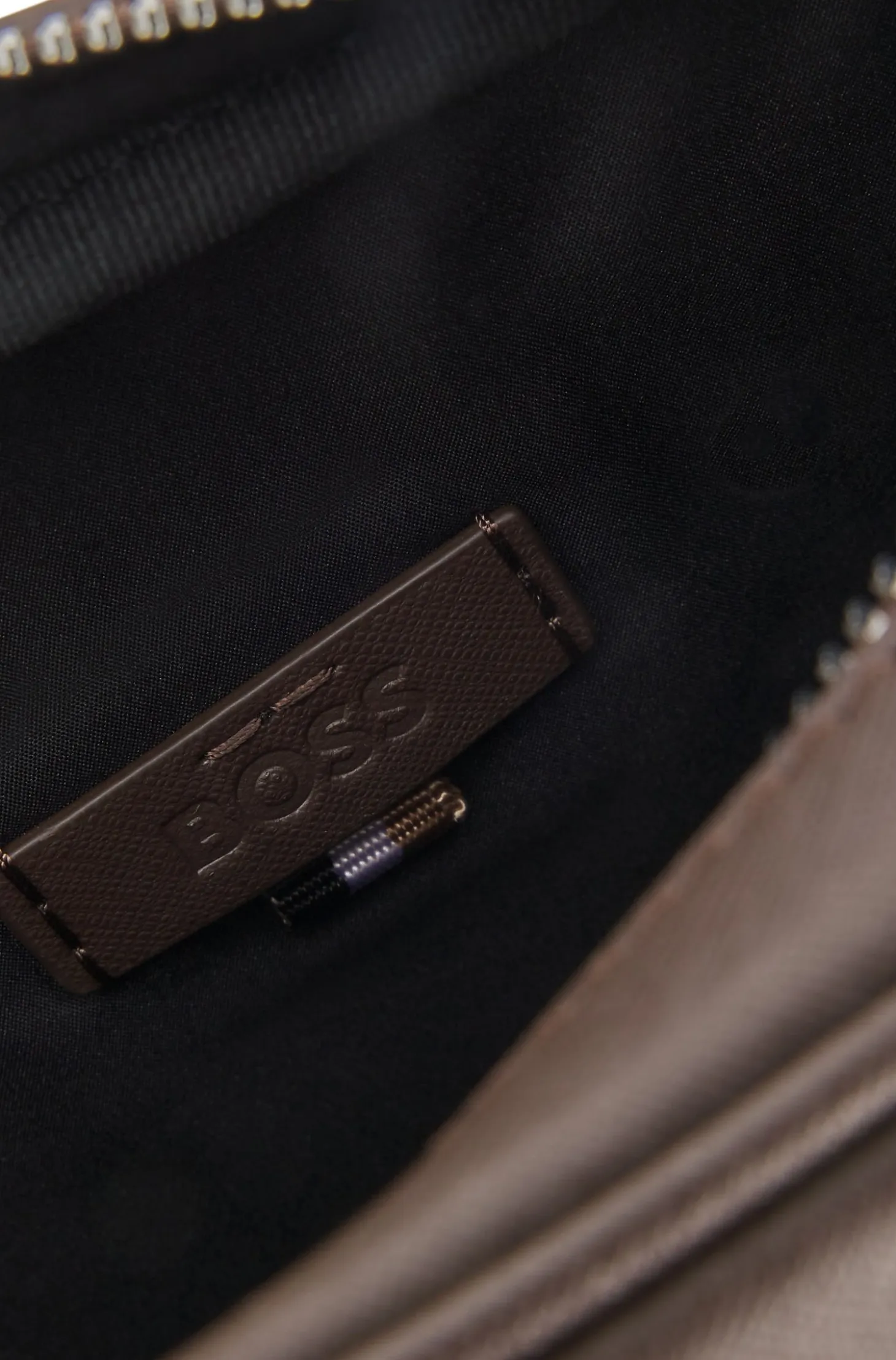 Reporter bag with silver-tone logo lettering