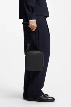 Reporter bag with silver-tone logo lettering