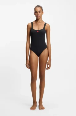 Ribbed swimsuit with red logo label