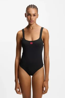 Ribbed swimsuit with red logo label