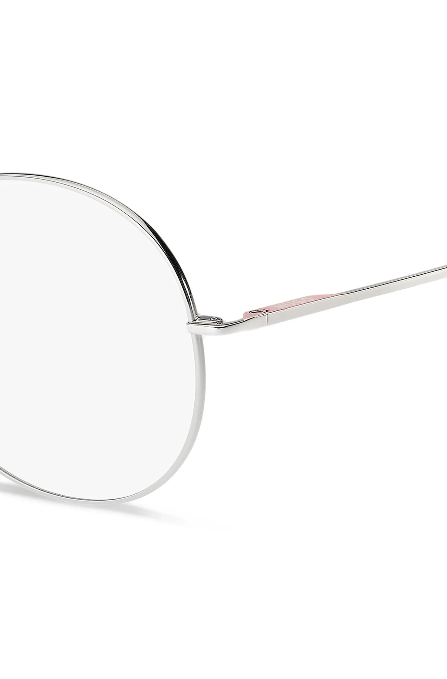 Round optical frames with rose-coloured trims