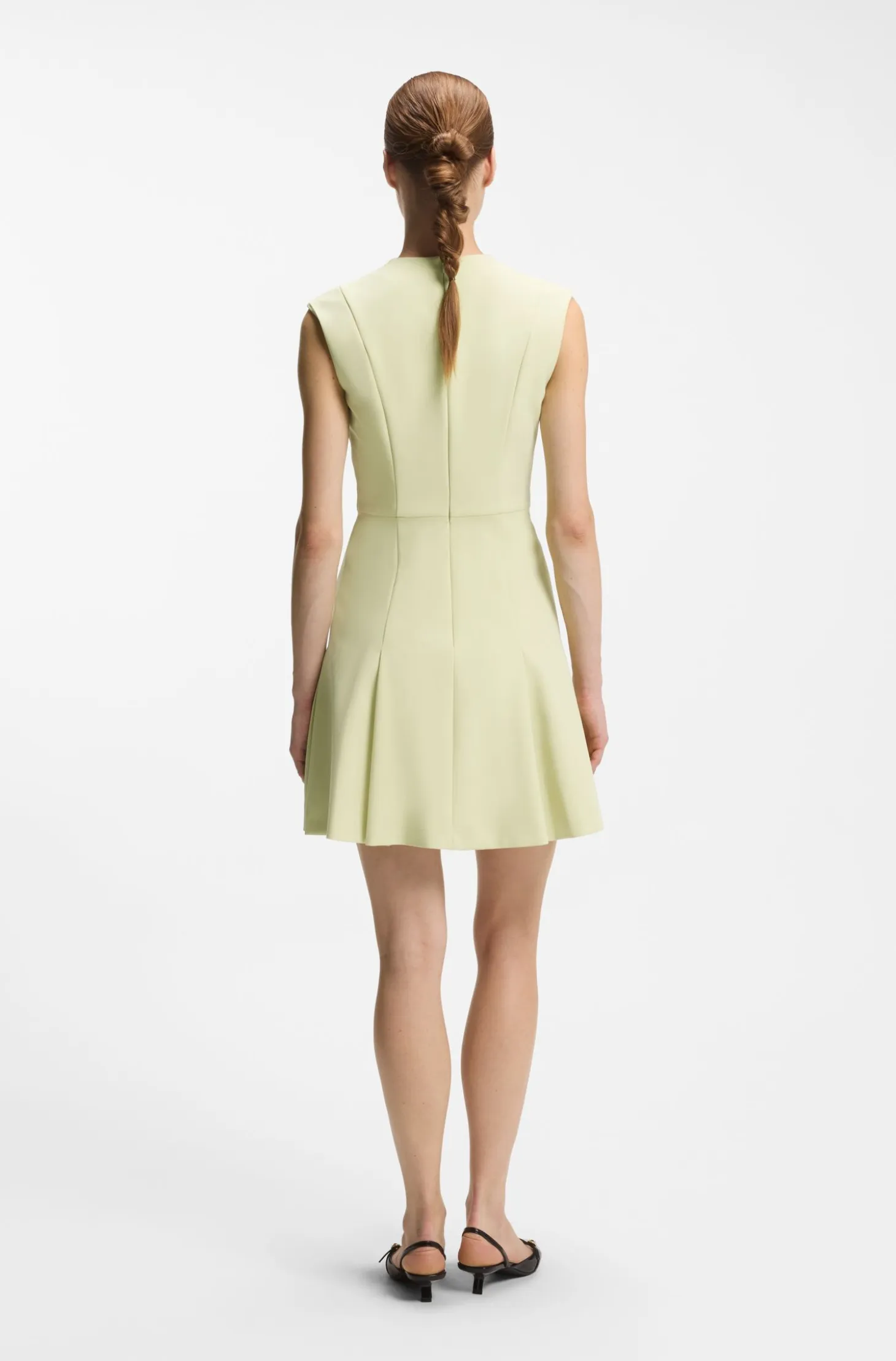 Sleeveless dress with gold-tone flower brooch