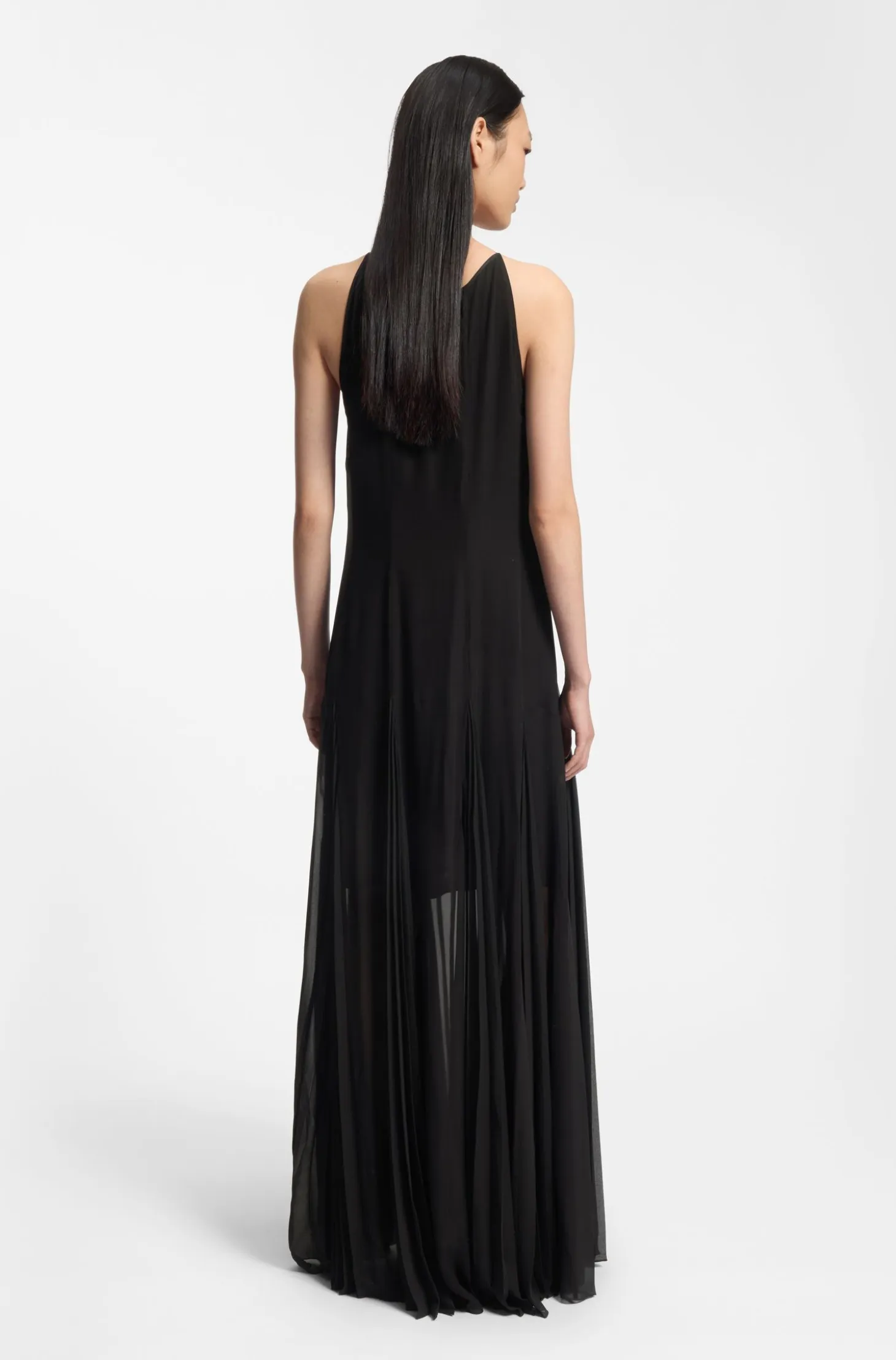 Sleeveless dress with plissé skirt inserts