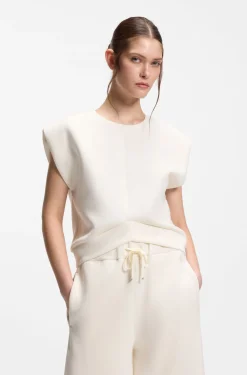 Sleeveless loose-fit sweatshirt with V-cut hemline
