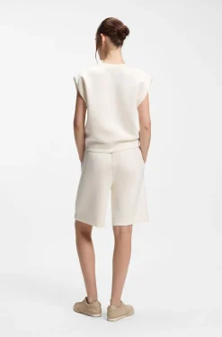 Sleeveless loose-fit sweatshirt with V-cut hemline