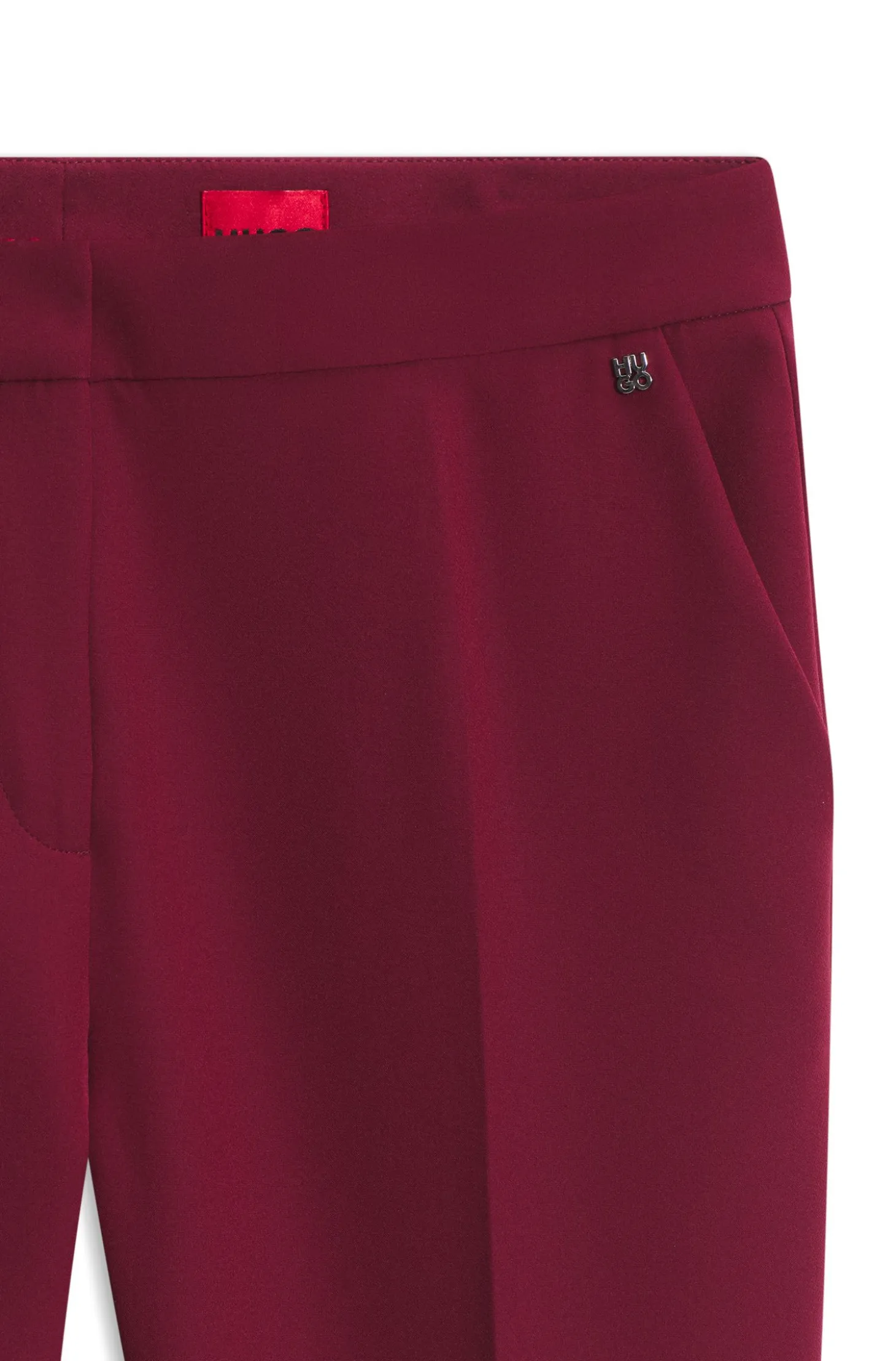 Slim-fit trousers in stretch fabric with logo rivet