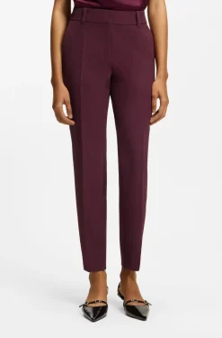 Slim-fit trousers with zip hems