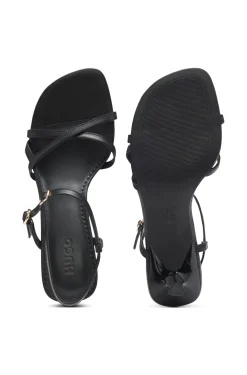 Strappy sandals in leather with asymmetric heel
