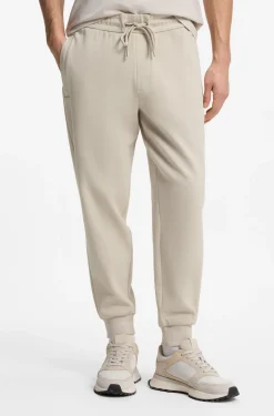 Stretch-cotton tracksuit bottoms with cuffed hems
