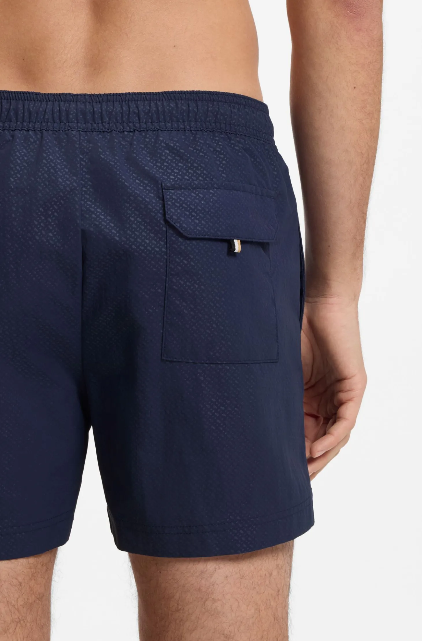 Swim shorts with all-over monogram print