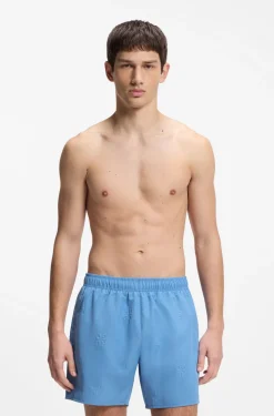 Swim shorts with all-over stacked logos