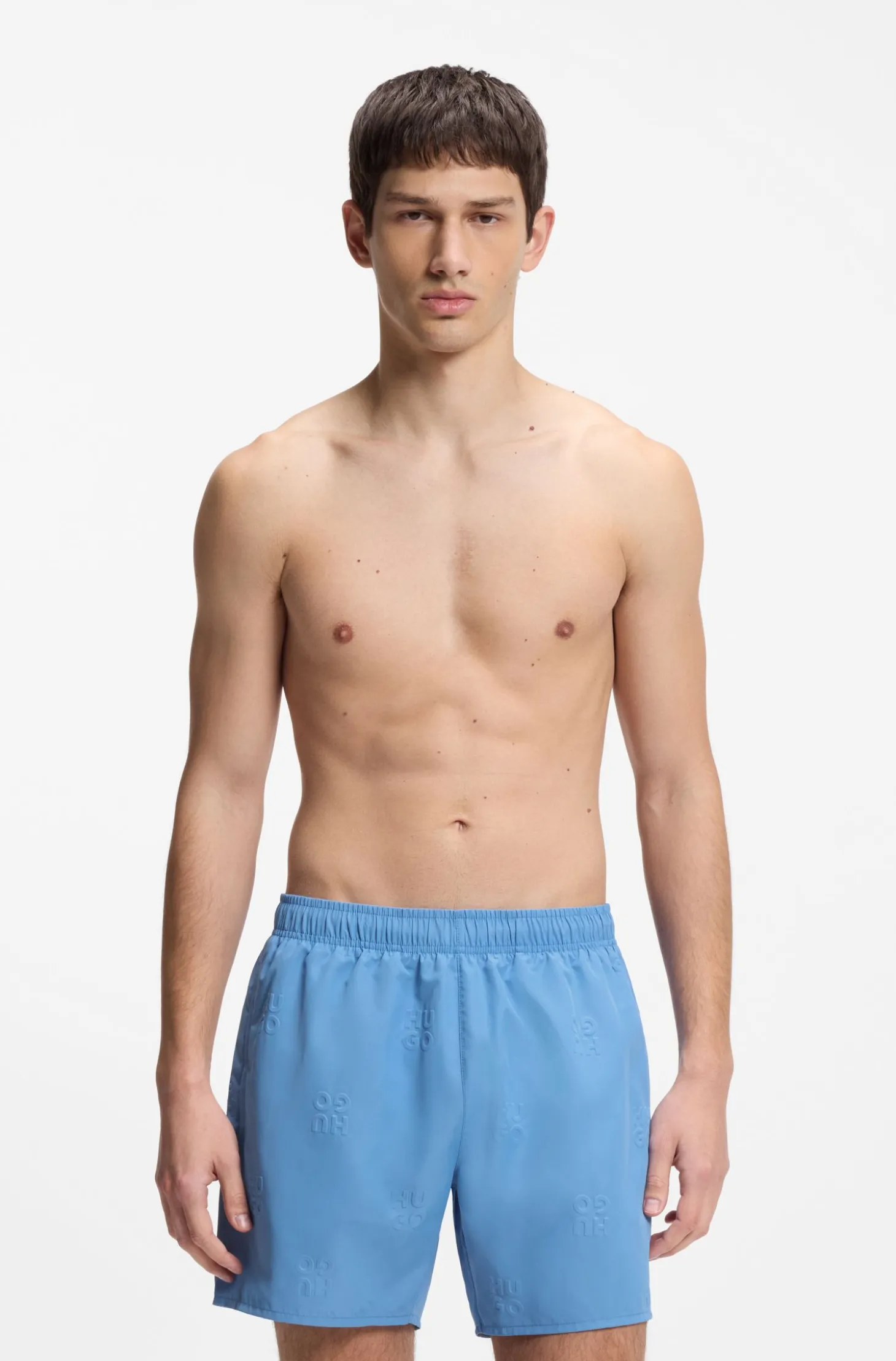 Swim shorts with all-over stacked logos
