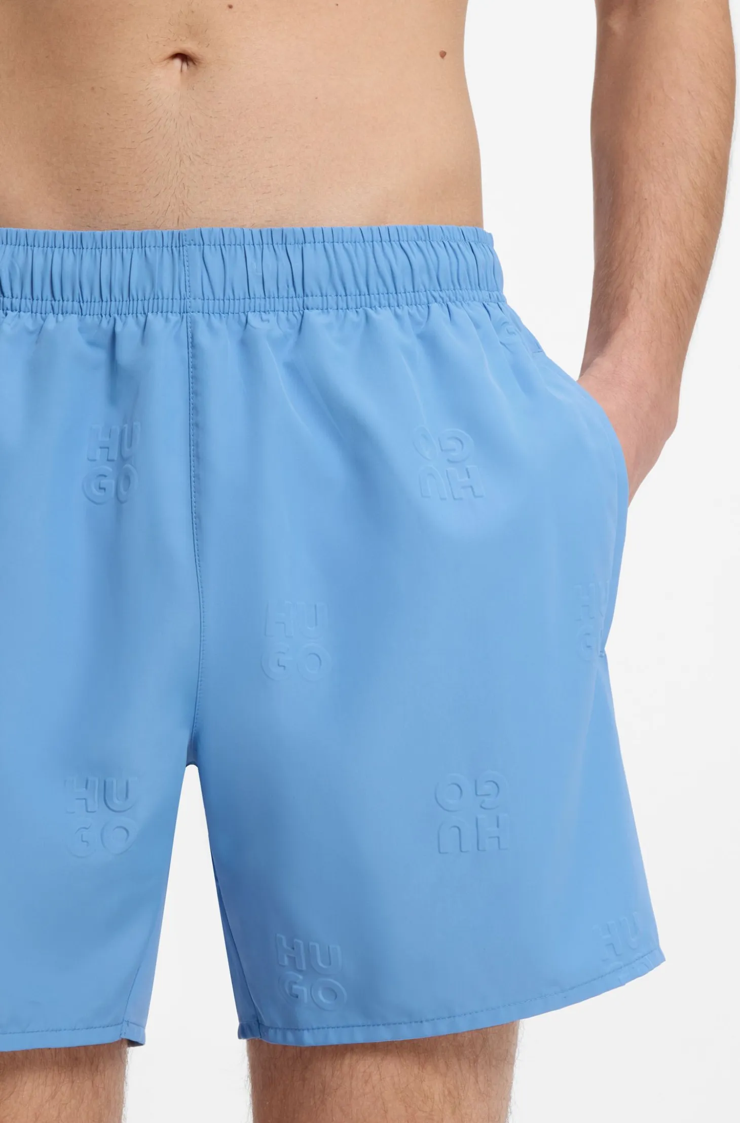 Swim shorts with all-over stacked logos