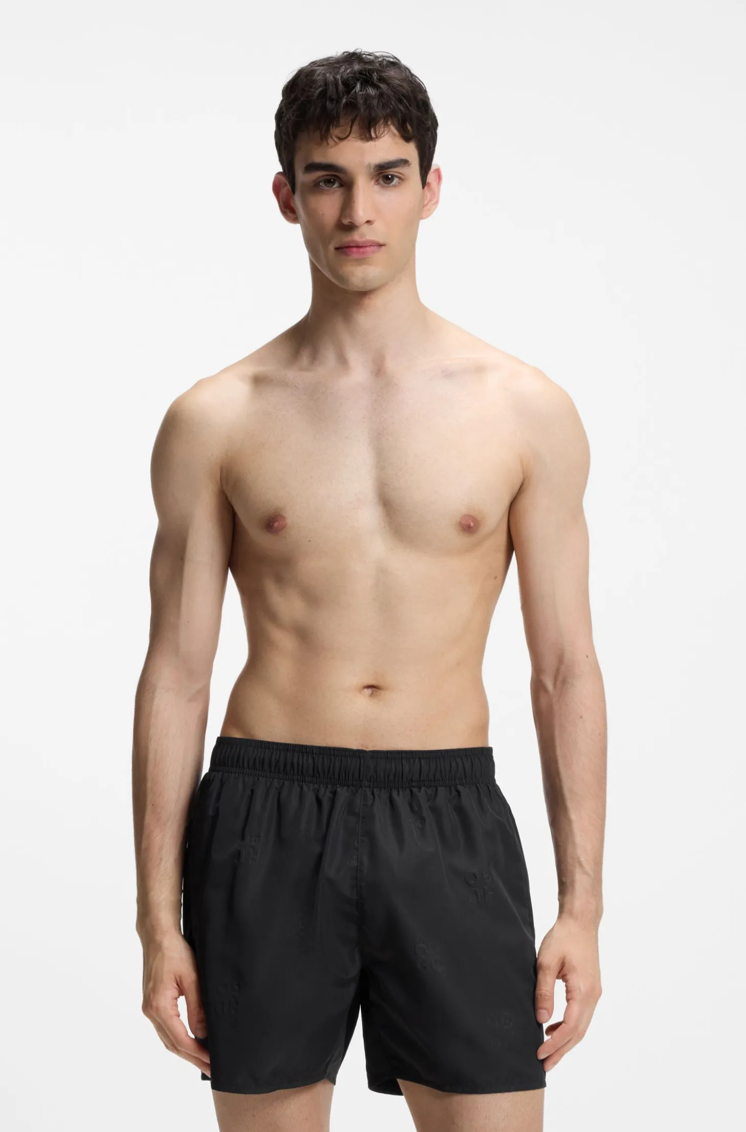 Swim shorts with all-over stacked logos