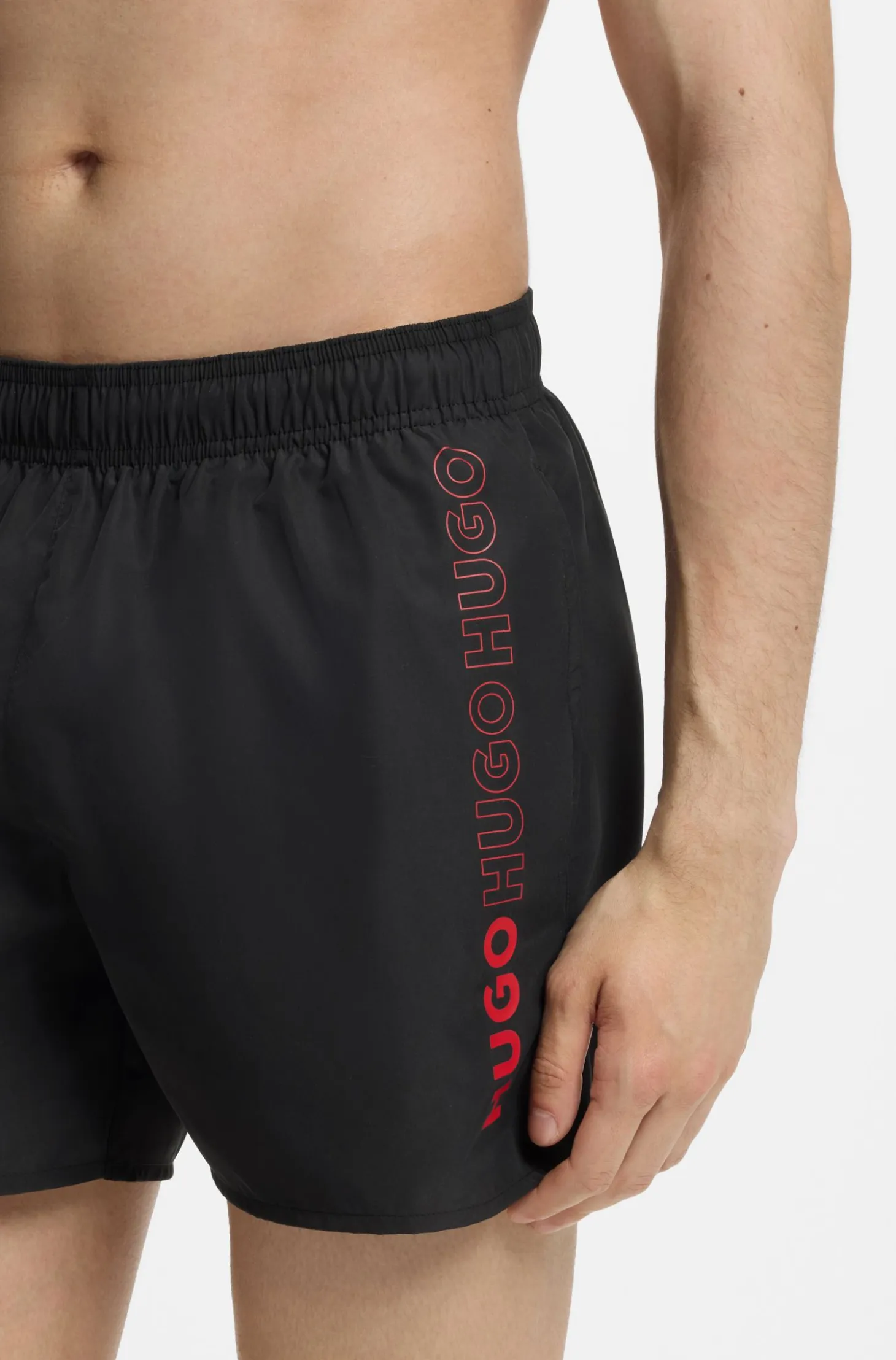 Swim shorts with repeat logos