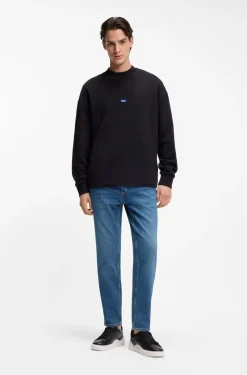 Tapered-fit jeans in mid-blue stretch denim