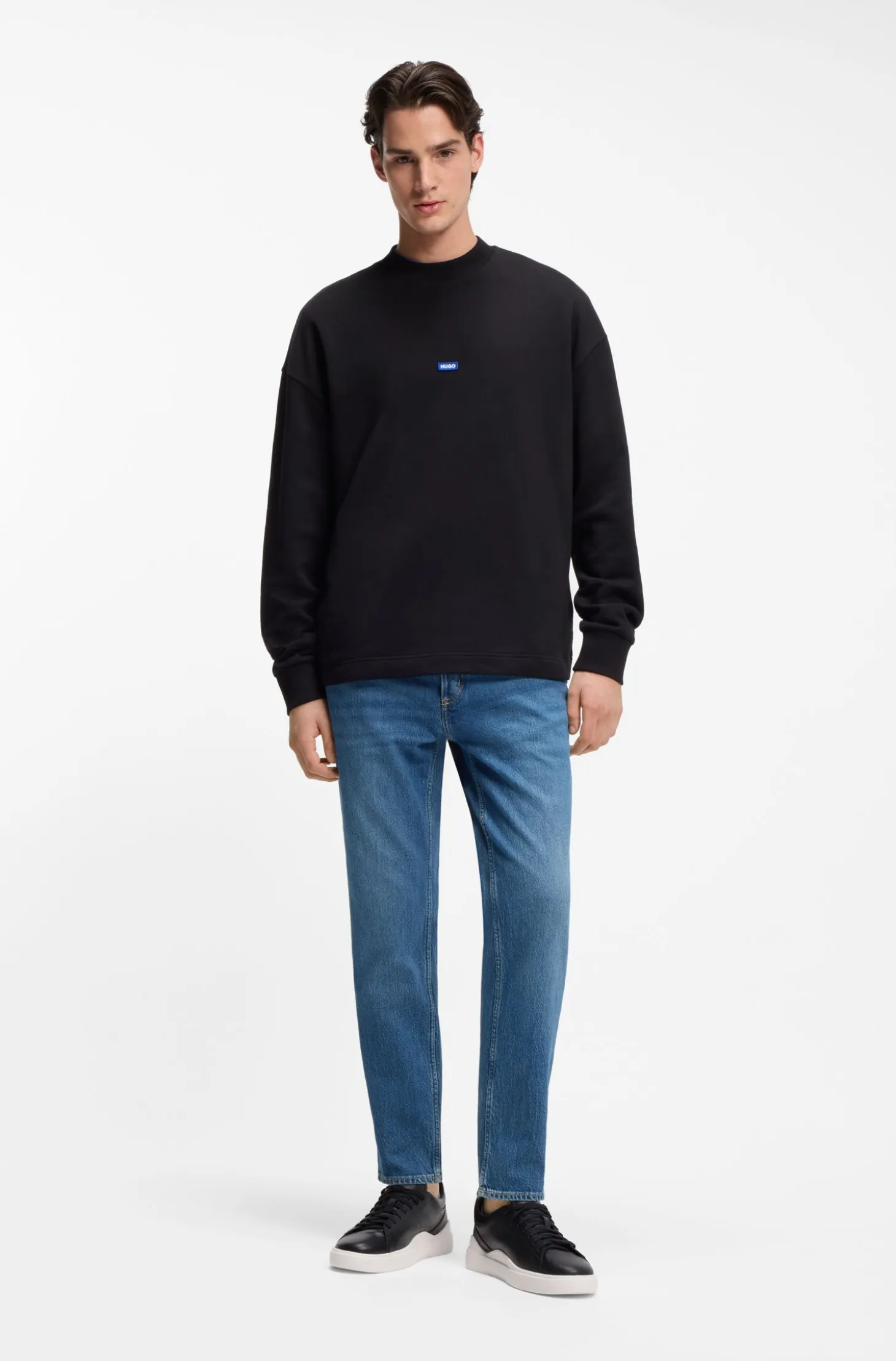 Tapered-fit jeans in mid-blue stretch denim