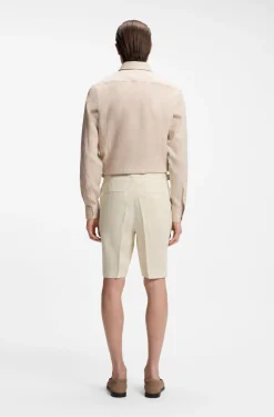 Tapered-fit shorts in linen with front pleats