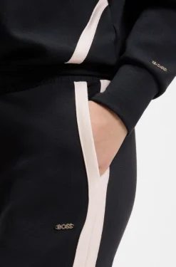 Tapered-fit tracksuit bottoms with contrast inserts