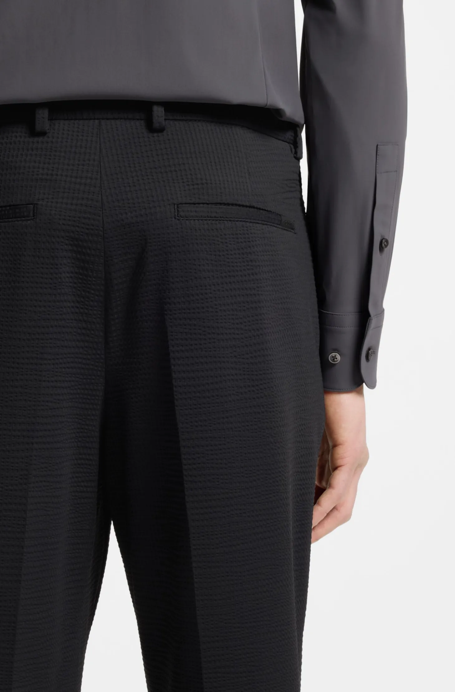 Tapered-fit trousers in stretch seersucker