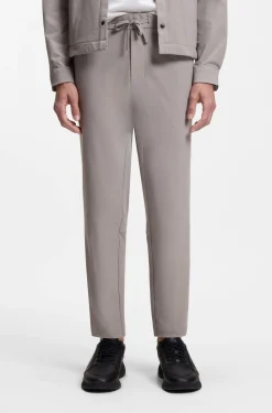 Tapered-fit trousers in waffle-structured stretch fabric
