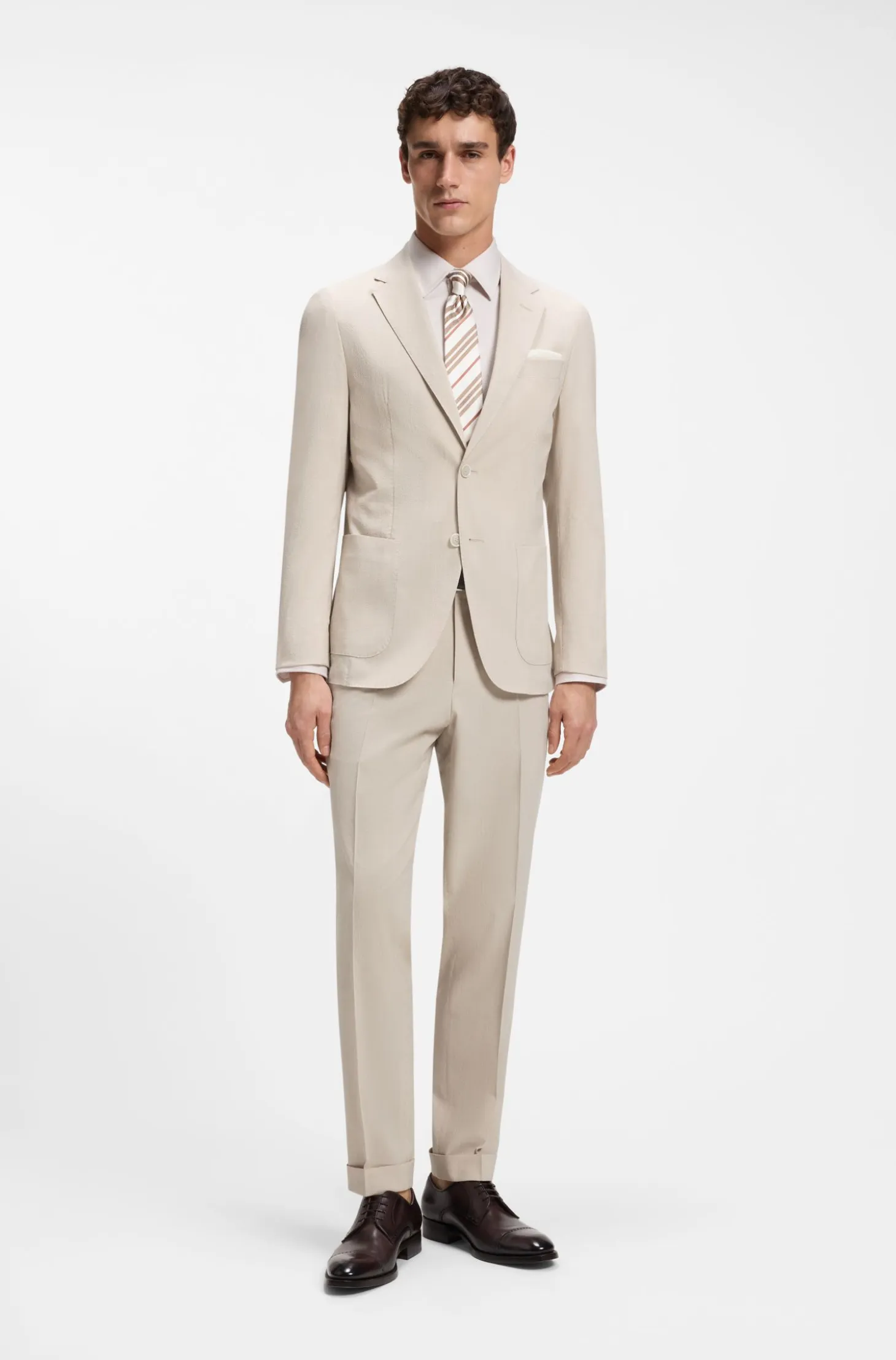 Tapered-fit trousers in wool-blend seersucker fabric