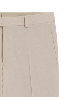 Tapered-fit trousers in wool-blend seersucker fabric