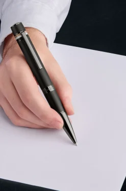 Textured-barrel ballpoint pen with signature-stripe ring