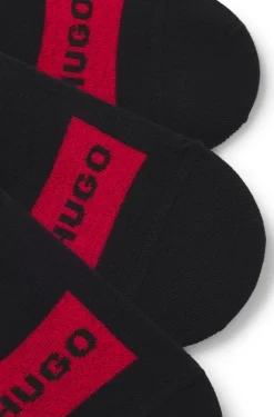 Three-pack of invisible socks with red logo labels