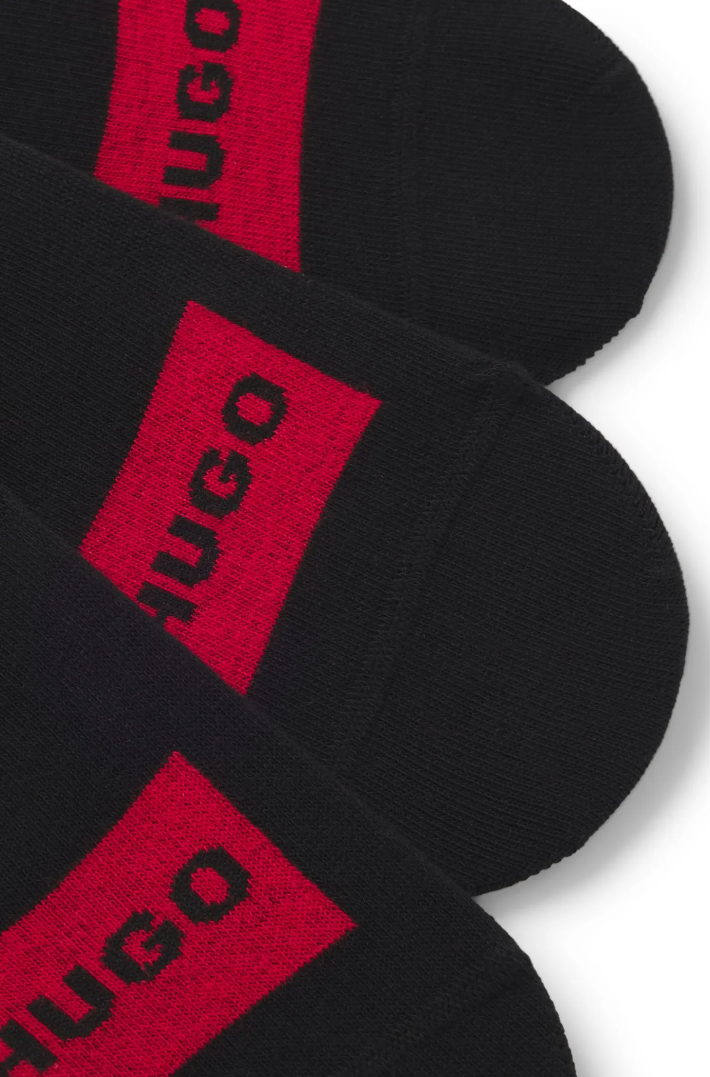 Three-pack of invisible socks with red logo labels