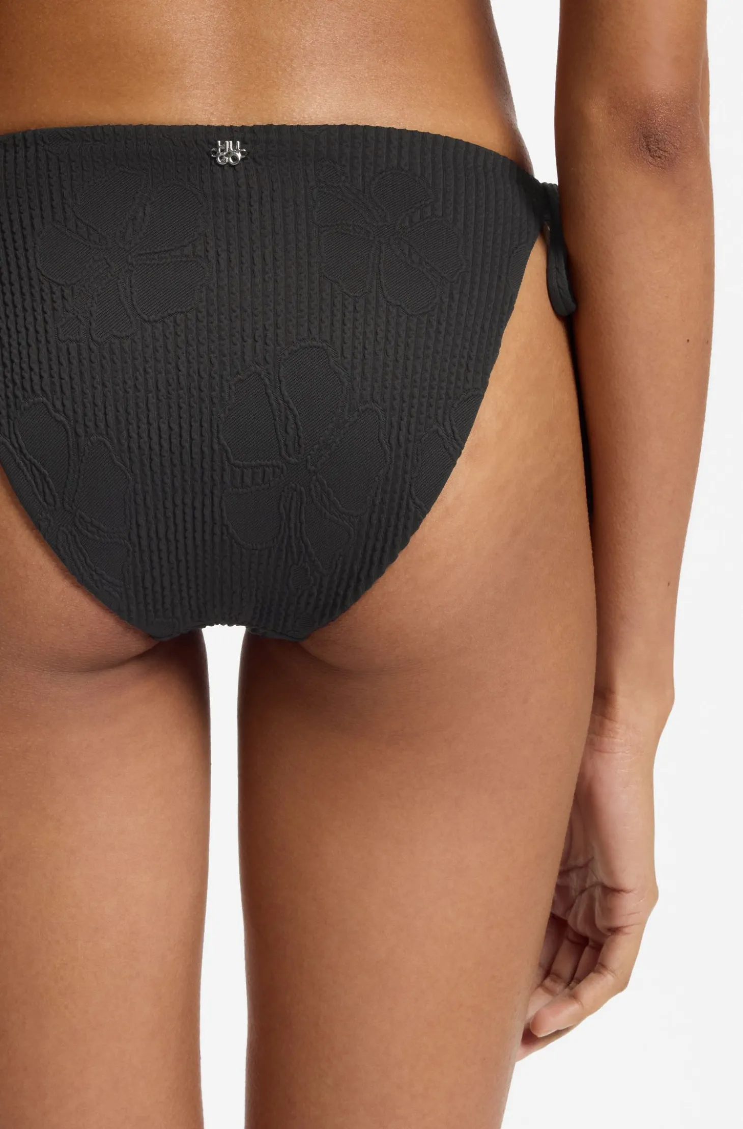 Tie-side bikini bottoms with structured tropical pattern