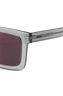 Transparent-acetate sunglasses with red lenses