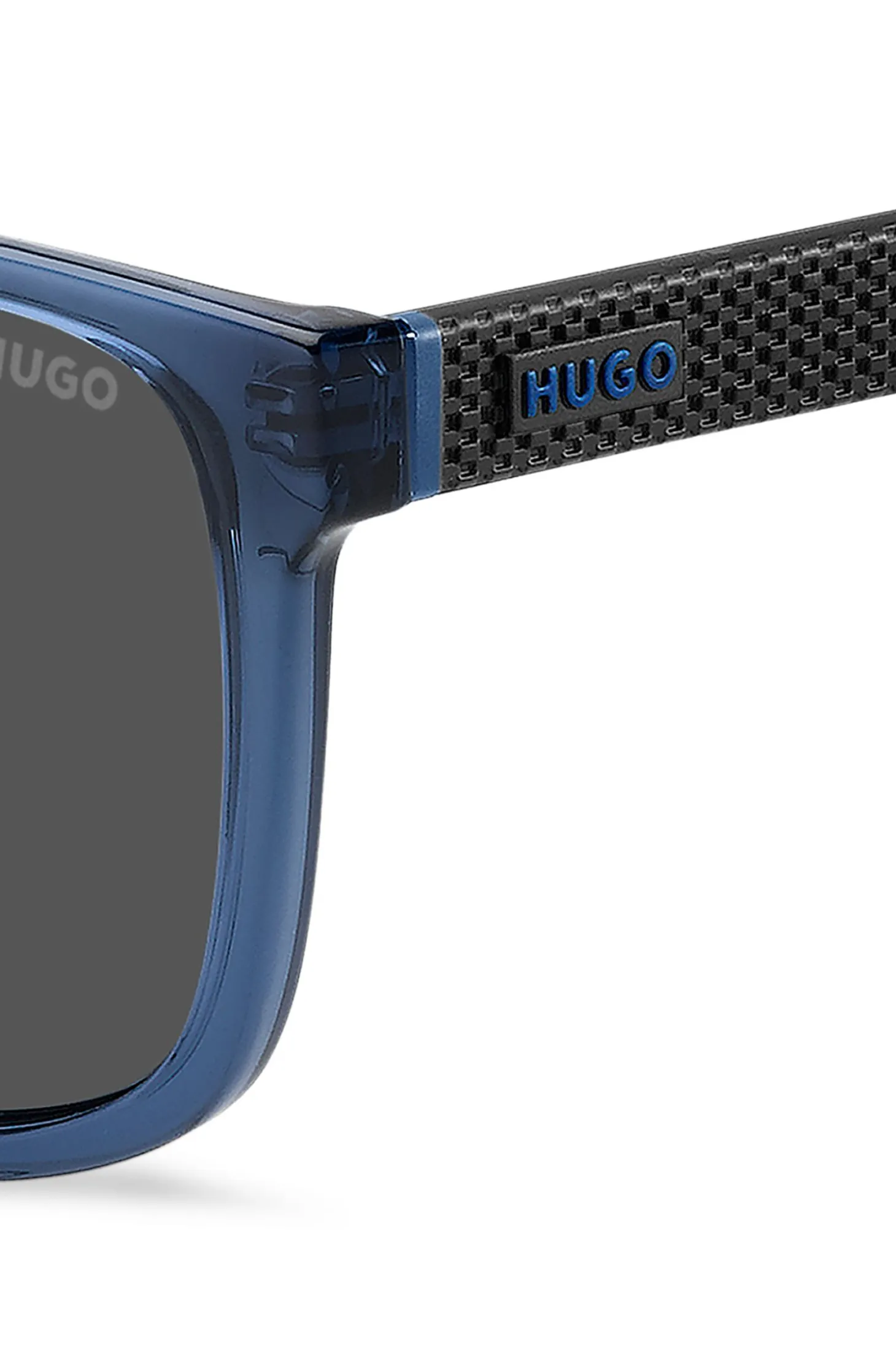 Transparent-blue sunglasses with patterned temples