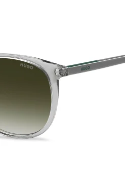 Transparent-grey sunglasses with green logo