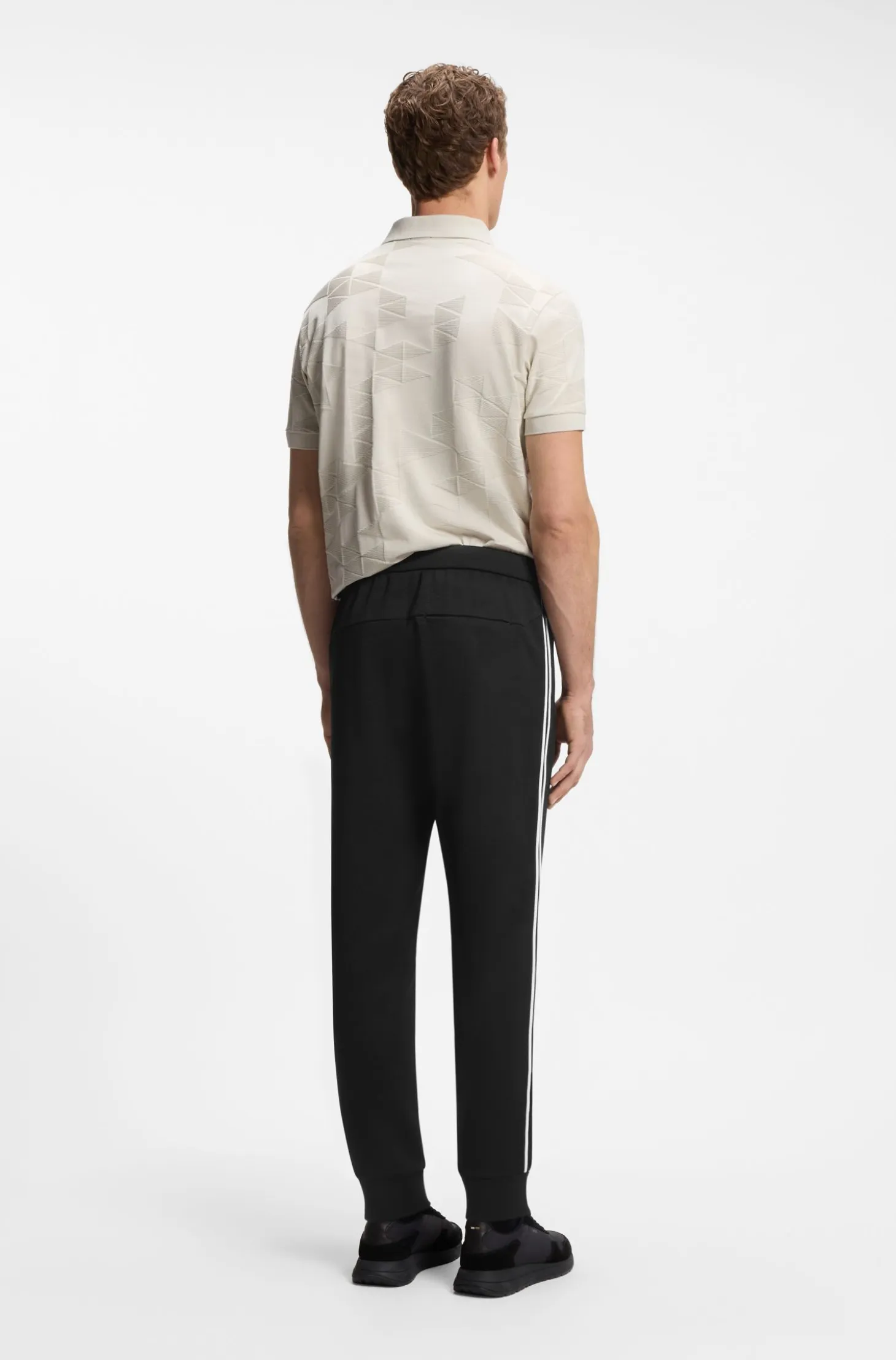 Triangle-jacquard tracksuit bottoms with rubberised logo