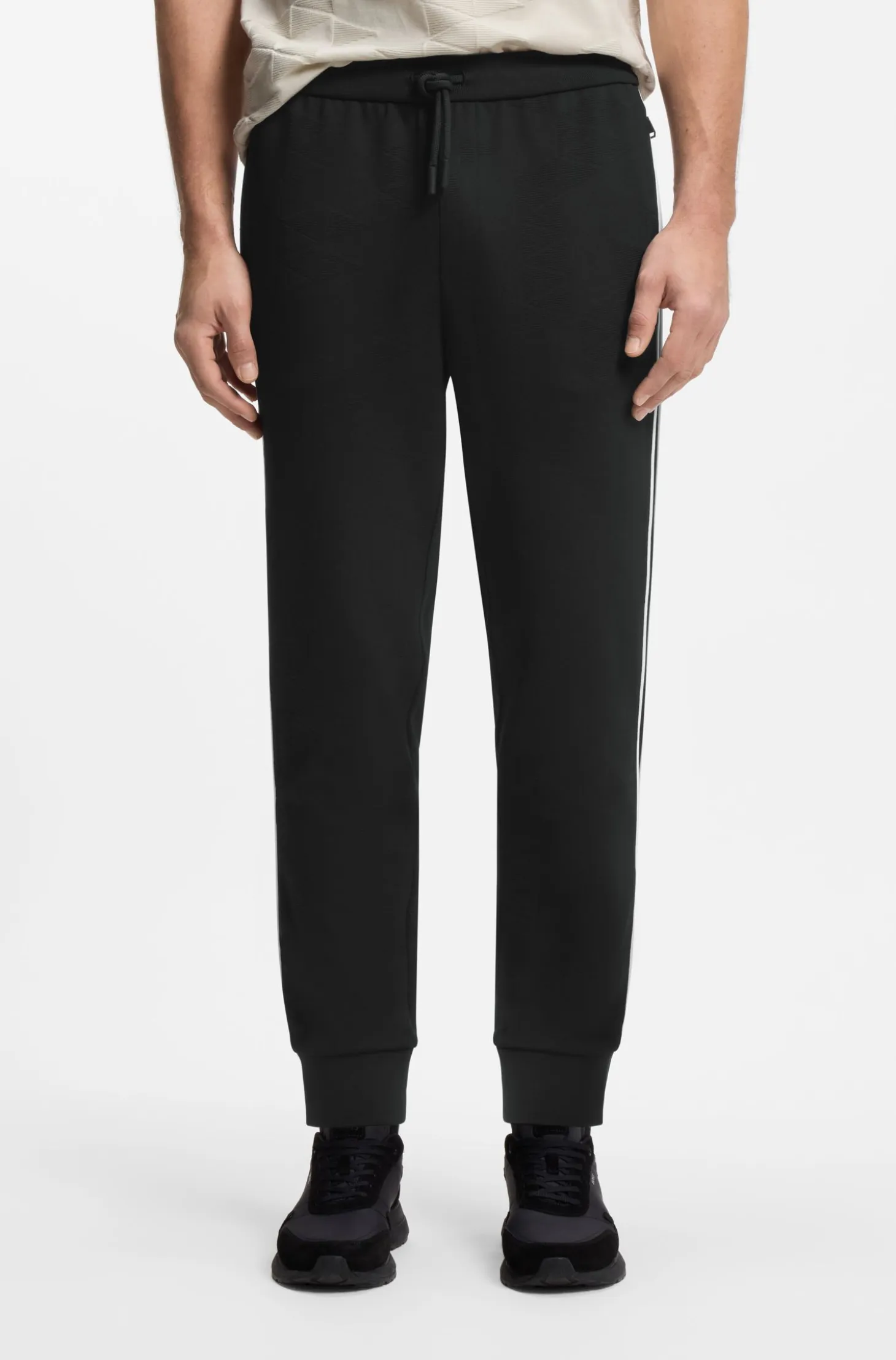 Triangle-jacquard tracksuit bottoms with rubberised logo