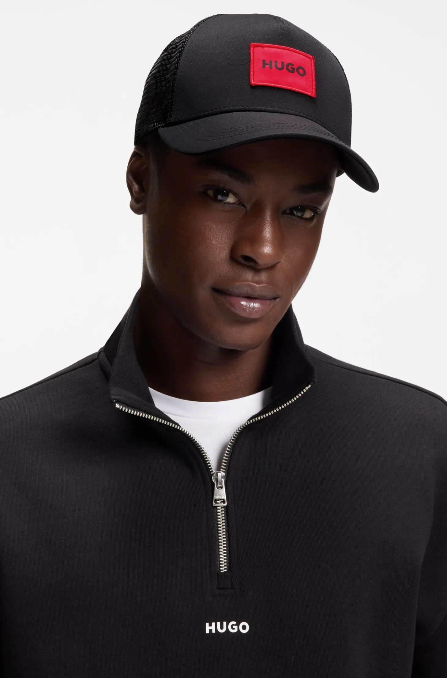 Twill trucker cap with red logo label