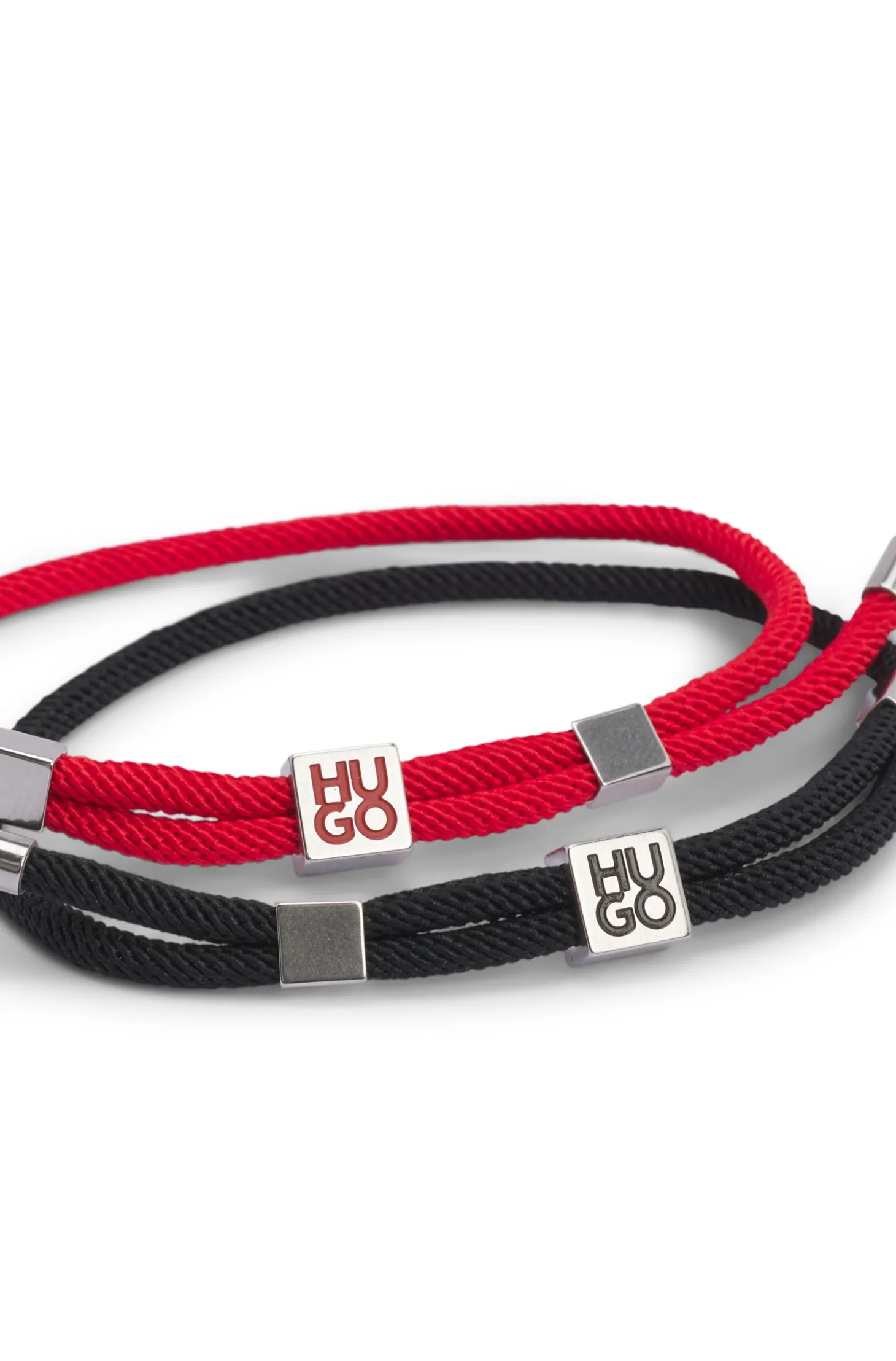Two-pack of cord cuffs with logo plaques