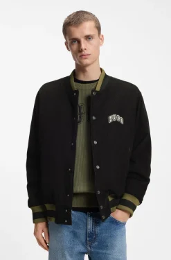 Varsity jacket in cotton corduroy with logo patch