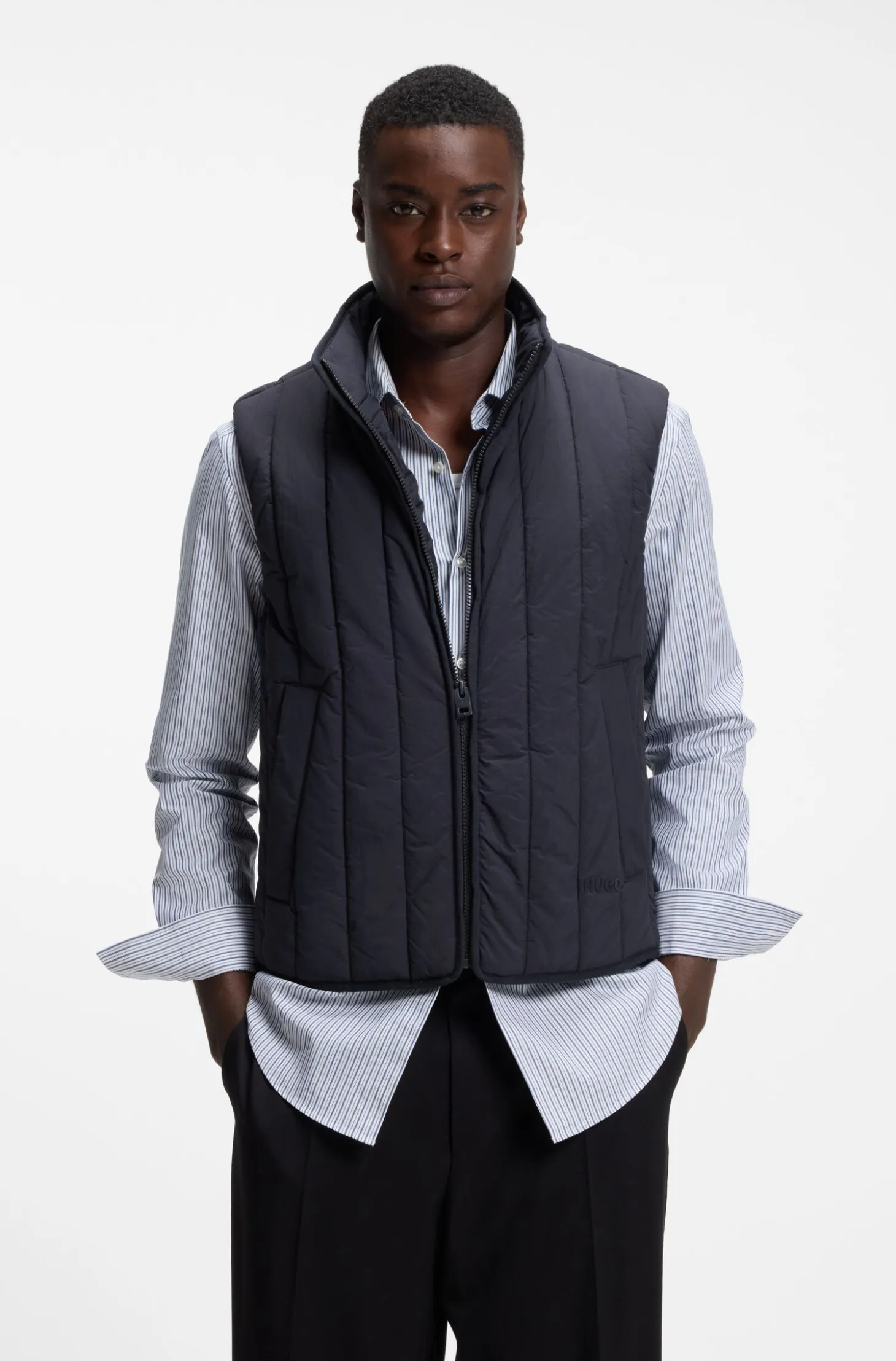 Vertical-quilted gilet with logo detail