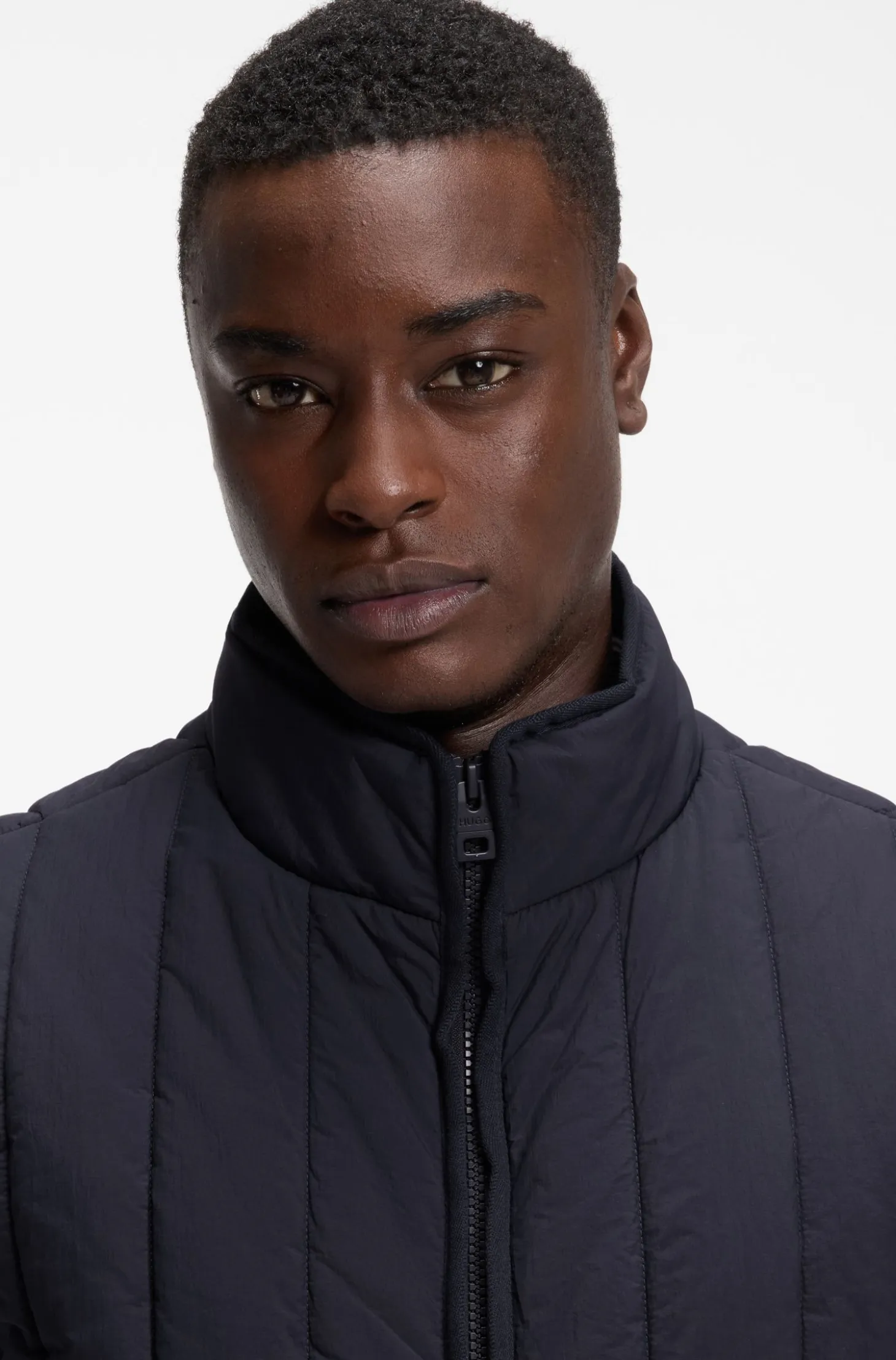 Vertical-quilted gilet with logo detail