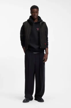 Vertical-quilted gilet with logo detail