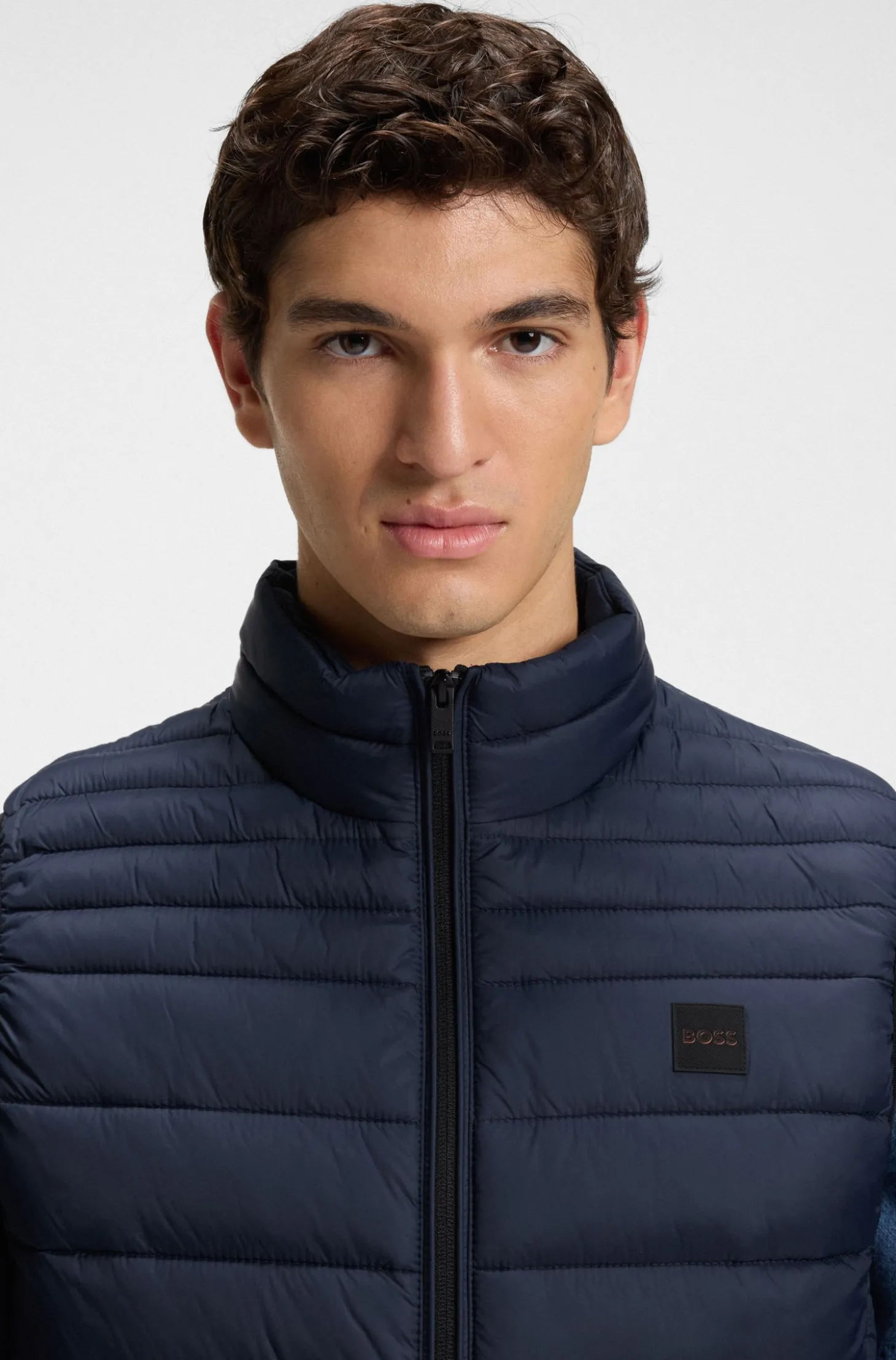 Water-repellent gilet with logo patch