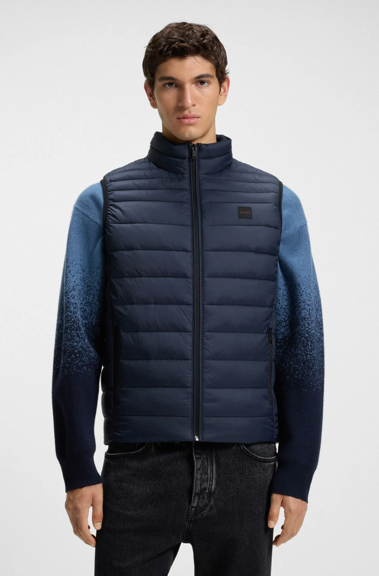 Water-repellent gilet with logo patch