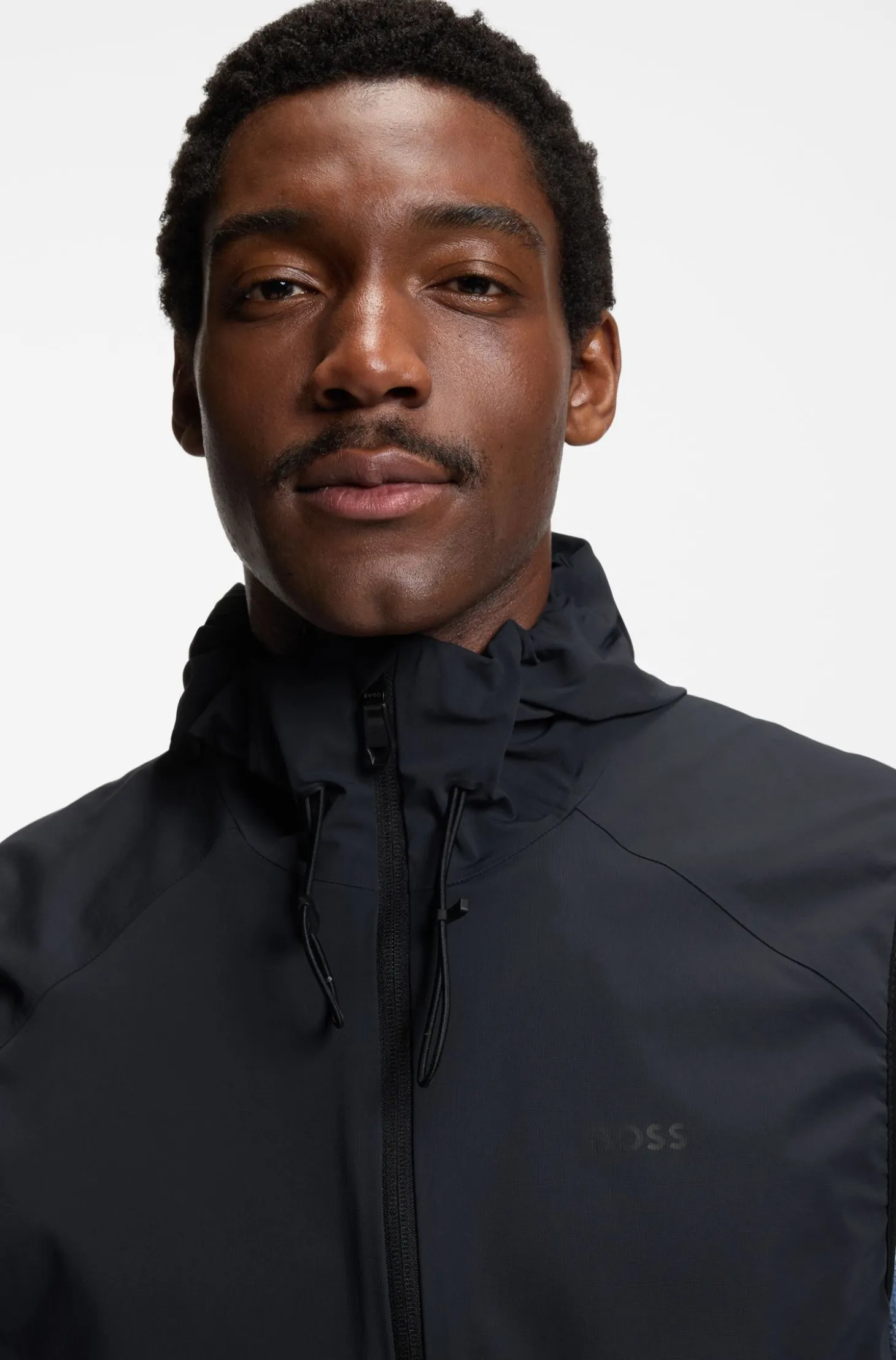 Water-repellent hooded gilet with micro-waffle structure