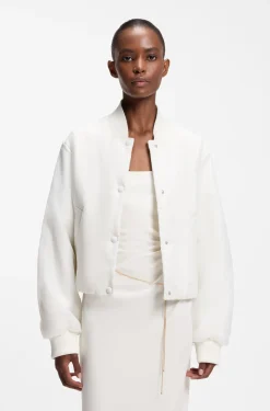 Water-repellent jacket with chiffon overlay