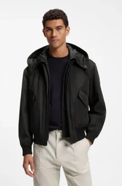 Water-repellent jacket with detachable hooded bib